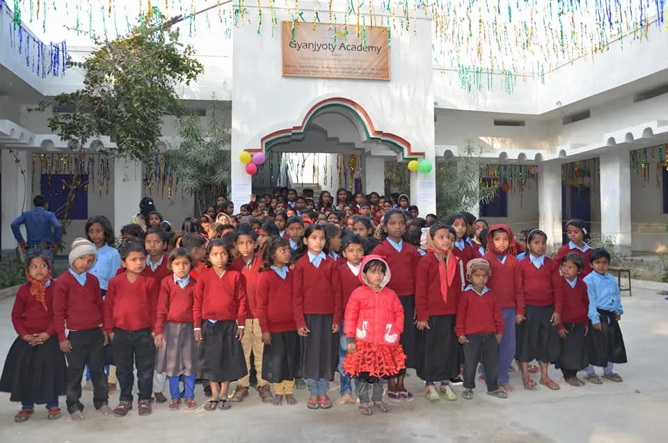 Children seated together at Gyanjyoty Academy, a free school for village children near Bodhgaya.
